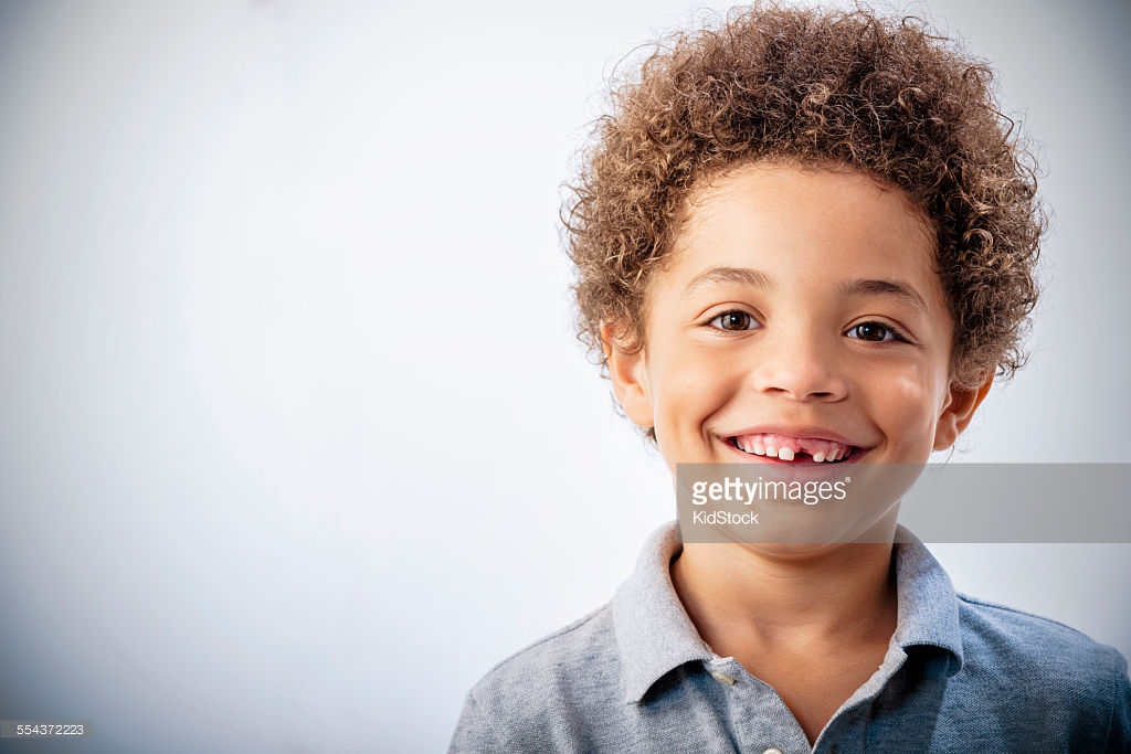 Mixed Race Boy With Curly Hair And Missing Tooth Smiling Delta Behavior Group